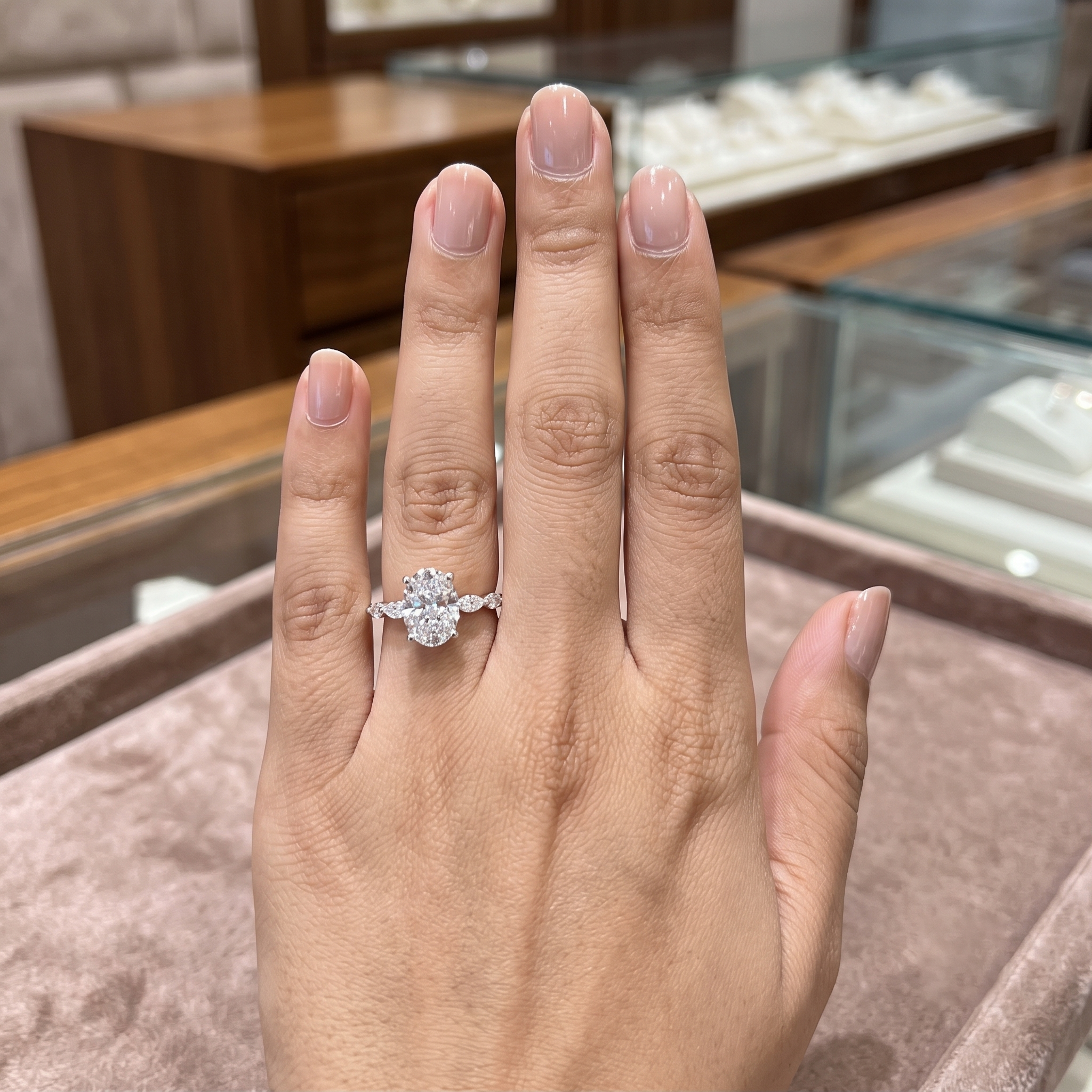 Oval Cut Solitaire Engagement Ring with Graduated Marquise Accent Band