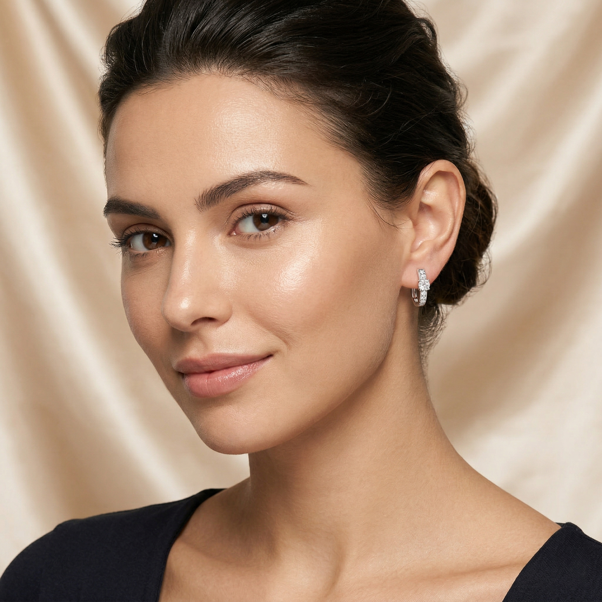 Prominent Center Round Diamond Surrounded By Smaller Pavé-Set Stones Hoop Earrings