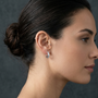 Channel-Set Row Of Round Shape Moissanite Diamond 925 Sterling Silver Half Hoop Earrings