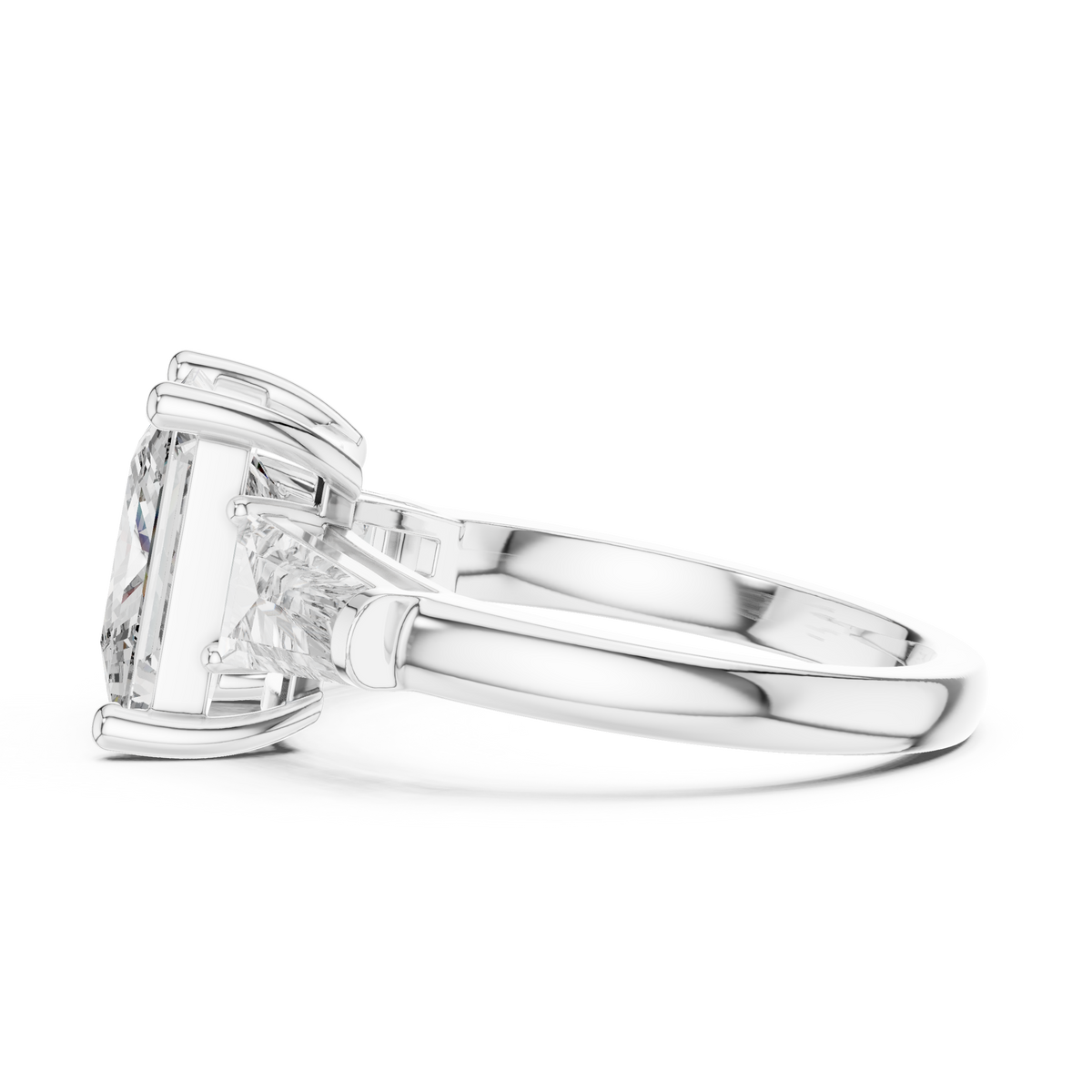 A Three-Stone Princess-Cut Engagement Ring with Tapered Baguette Accents