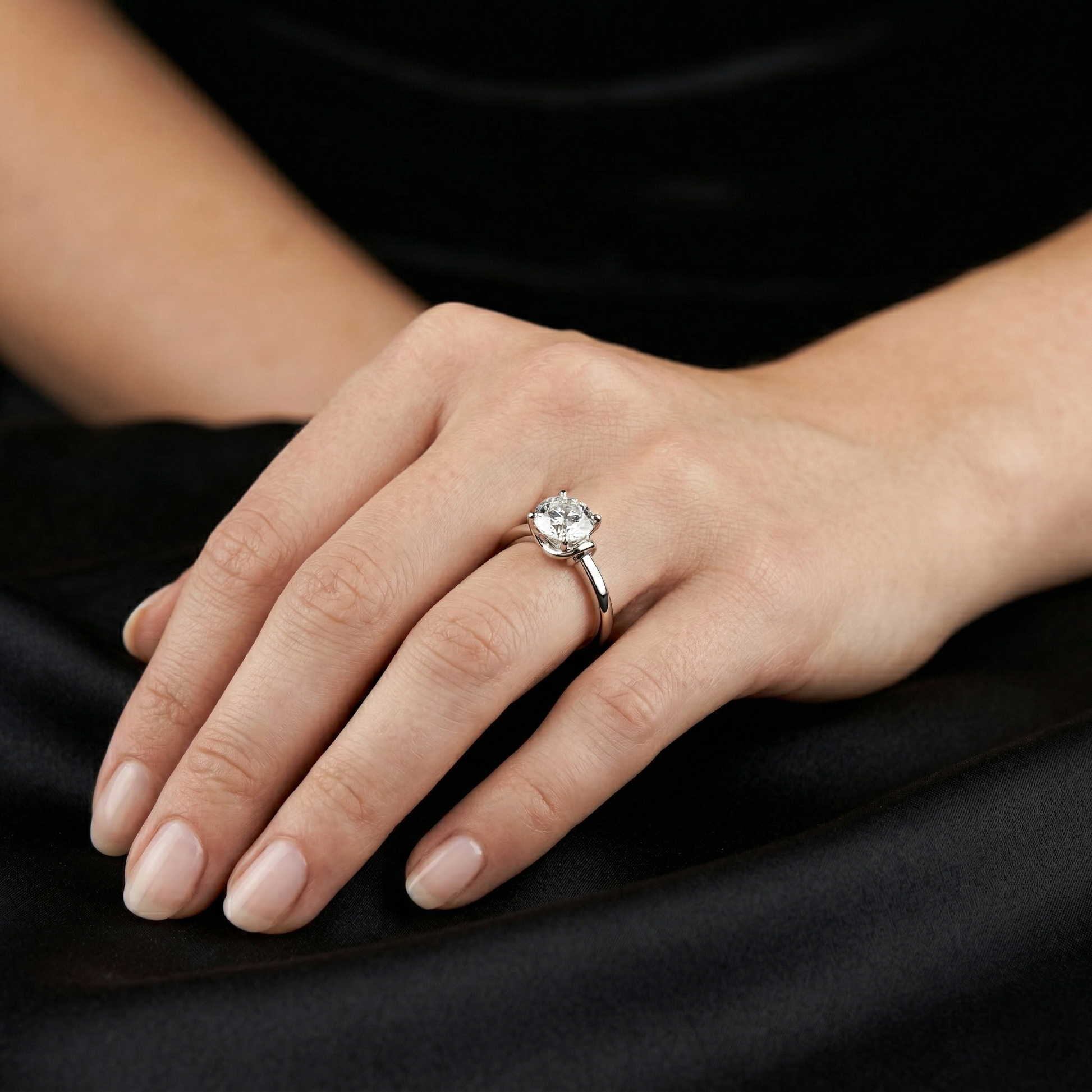 Sterling Silver Round Solitaire Moissanite Engagement Ring with a Four-prong Setting