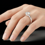 Sterling Silver Round Solitaire Moissanite Engagement Ring with a Four-prong Setting