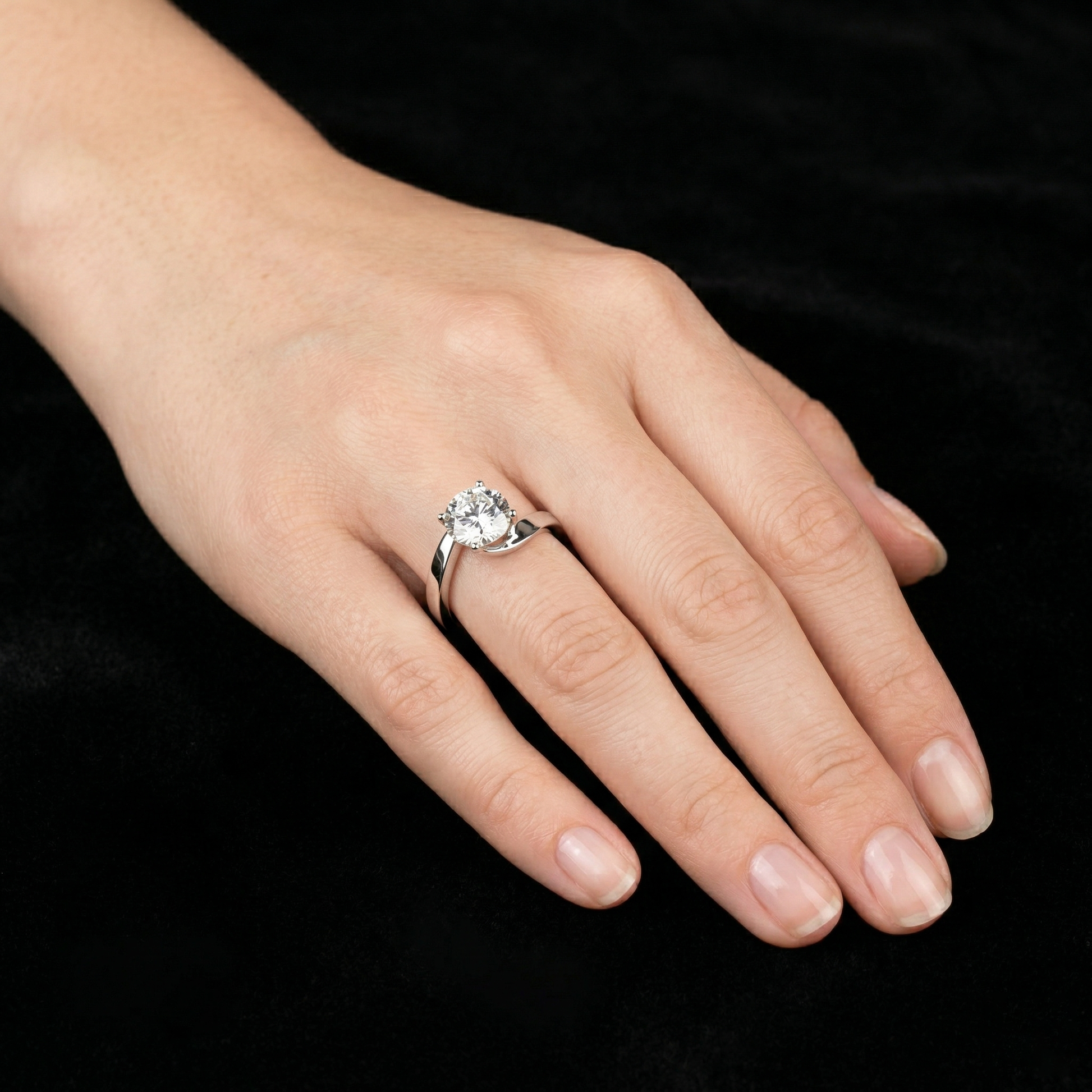 Round Moissanite Silver Solitaire Engagement Ring with a Swirl Band Design