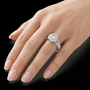 Brilliant Halo Engagement Ring With Central Round Cut Diamond Surrounded By Smaller Pavé Diamonds