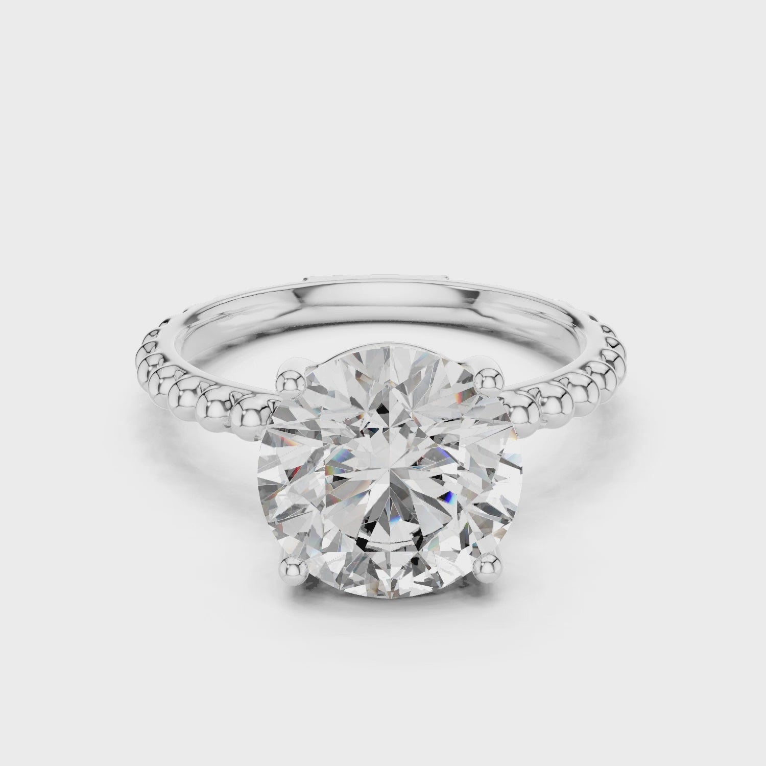 Round Solitaire Moissanite Engagement Ring with a Beaded Milgrain Band in Silver