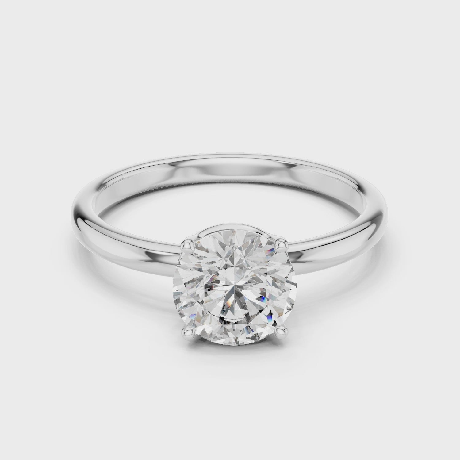 Sterling Silver Round Solitaire Moissanite Engagement Ring with a Four-prong Setting