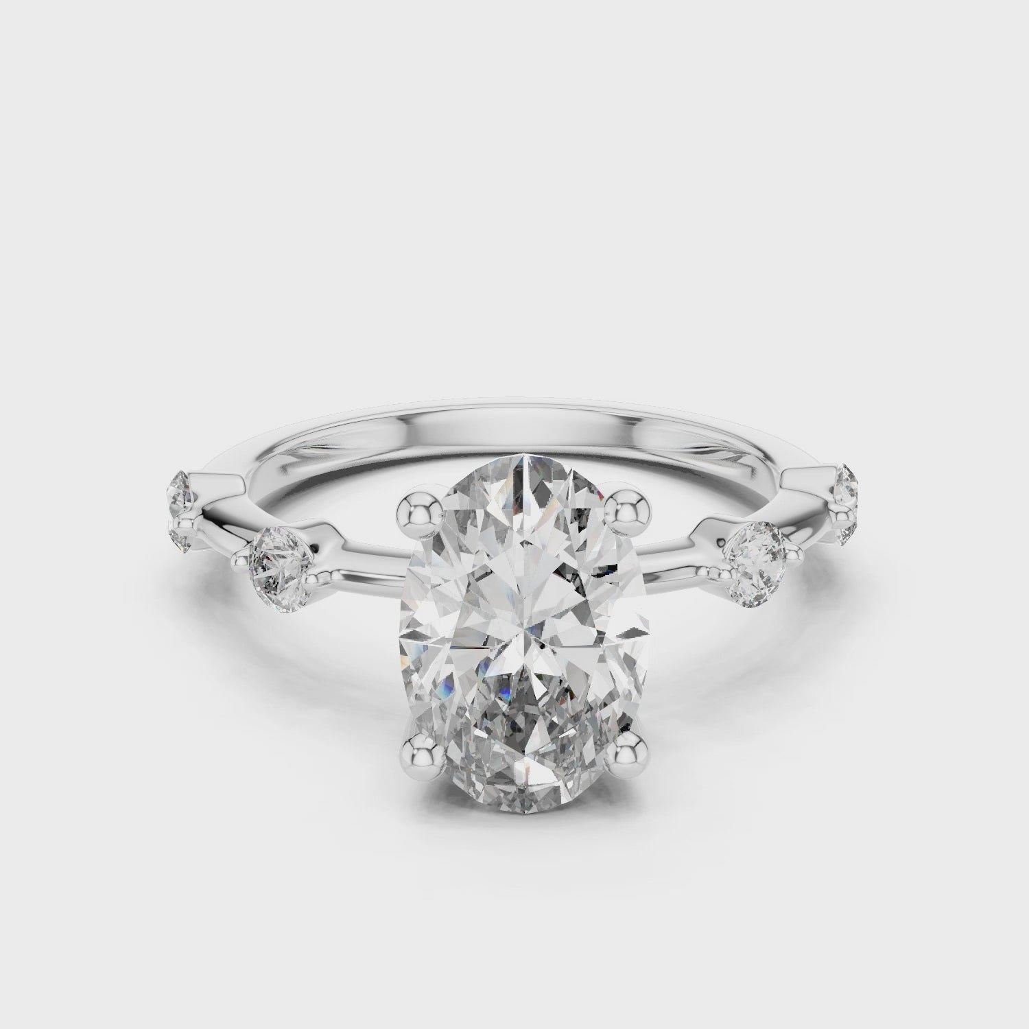 Oval-cut Moissanite Solitaire Engagement Ring with Raindrop Style Side Accent Stones