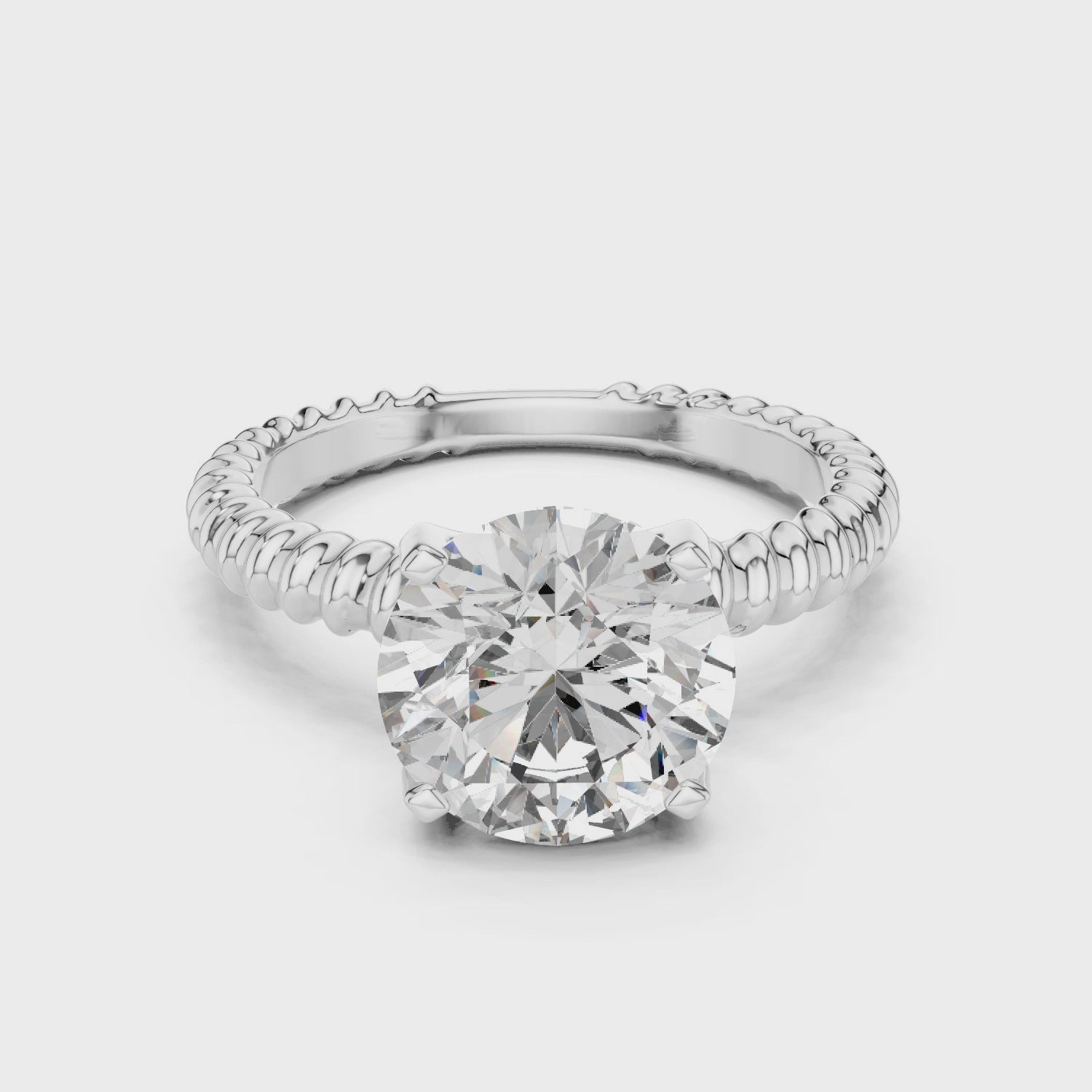 Silver Round-cut Solitaire Moissanite Diamond Set in a Band with a Braided Texture
