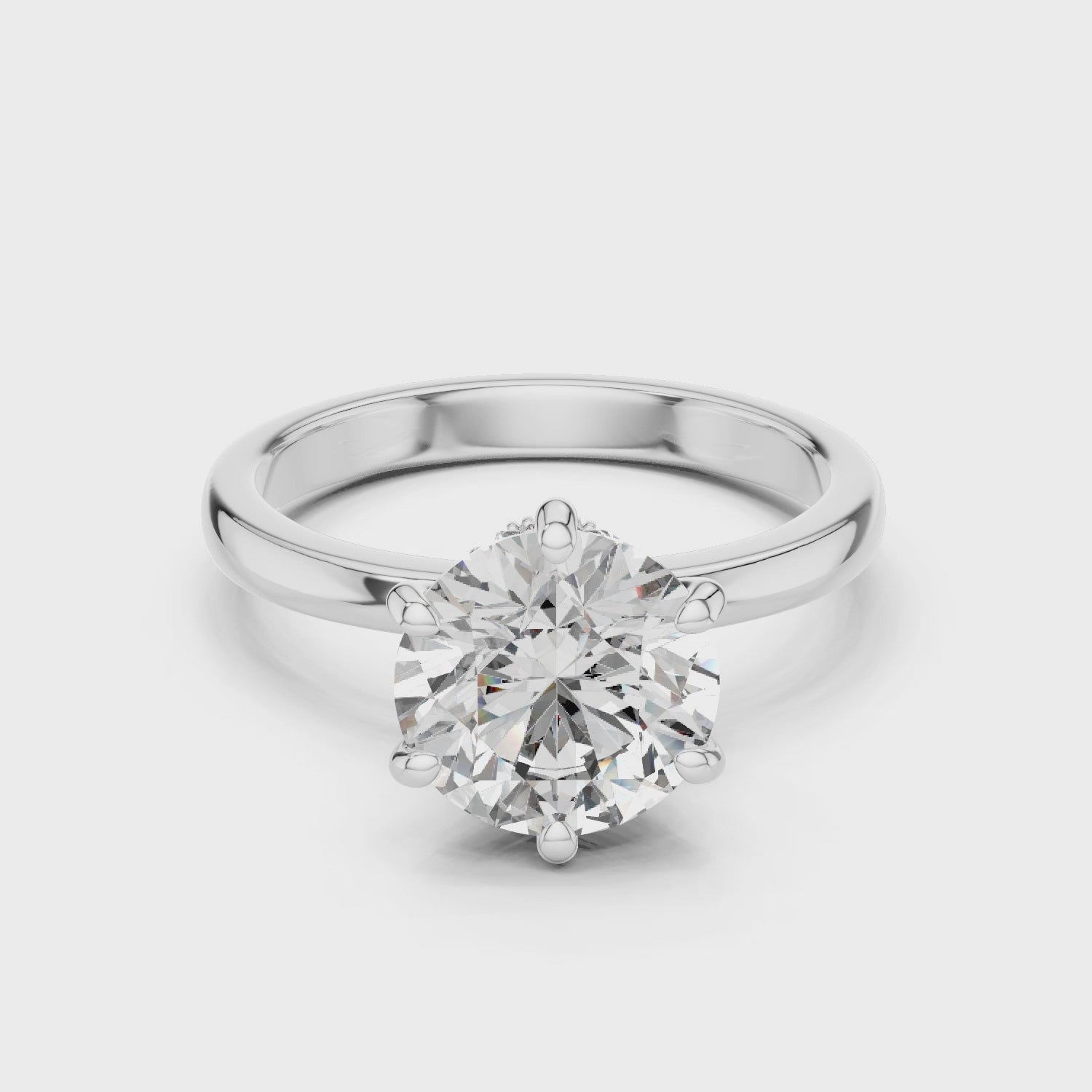 The Hidden Halo Round Cut Moissanite Solitaire Diamond Setting With A Bypass Or Twist Band